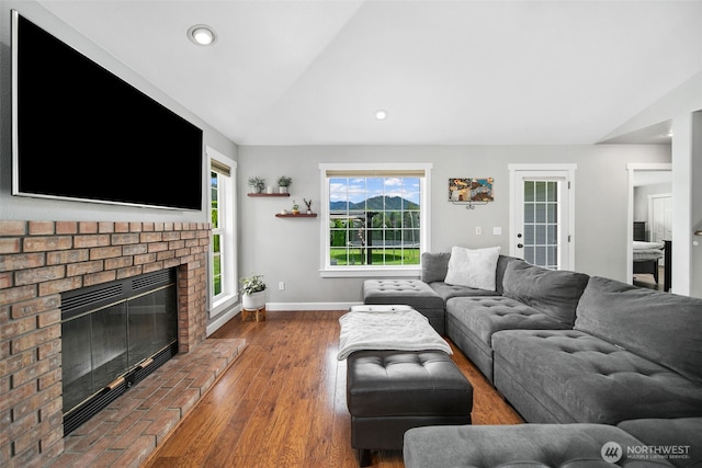 114 Creekside Pl, Cashmere, WA 98815 - living room featuring vaulted ceiling, a brick fireplace, baseboards, recessed lighting, and wood finished floors
