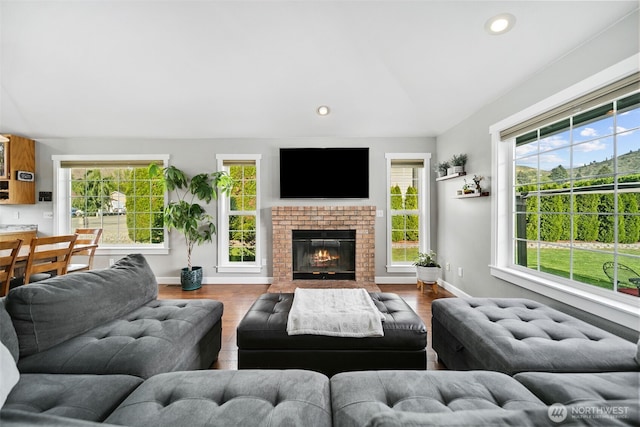 114 Creekside Pl, Cashmere, WA 98815 - living room with lofted ceiling, baseboards, wood finished floors, recessed lighting, and a brick fireplace