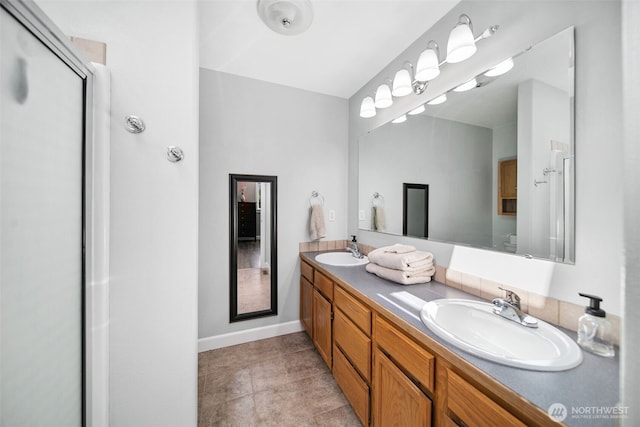 114 Creekside Pl, Cashmere, WA 98815 - full bath with double vanity, baseboards, a shower with door, and tile patterned floors