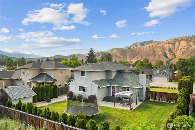 114 Creekside Pl, Cashmere, WA 98815 - rear view of property with a patio area, a trampoline, a residential view, and a mountain view
