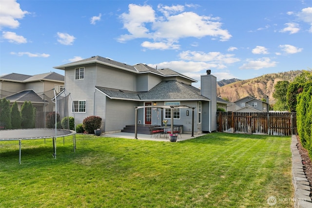 114 Creekside Pl, Cashmere, WA 98815 - back of property featuring a trampoline, a patio, and a mountain view