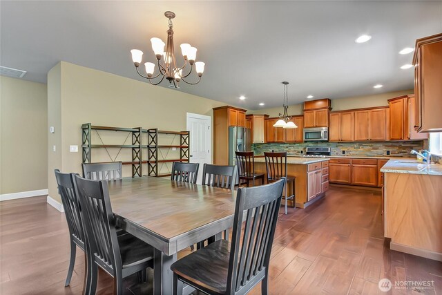 9440 Piperhill Dr SE, Olympia, WA 98513 - dining room featuring dark wood finished floors, a chandelier, recessed lighting, and baseboards