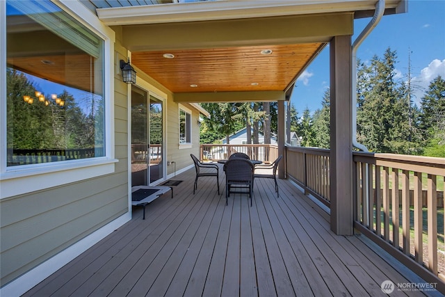 9440 Piperhill Dr SE, Olympia, WA 98513 - wooden terrace featuring outdoor dining space