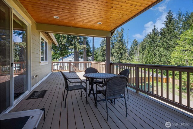 9440 Piperhill Dr SE, Olympia, WA 98513 - wooden terrace with outdoor dining area