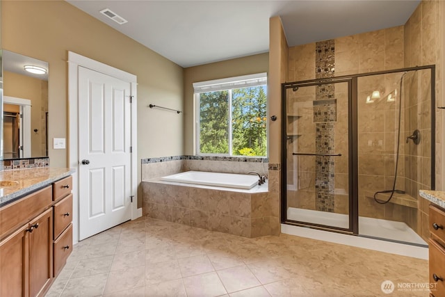 9440 Piperhill Dr SE, Olympia, WA 98513 - bathroom featuring vanity, a bath, a stall shower, and tile patterned flooring