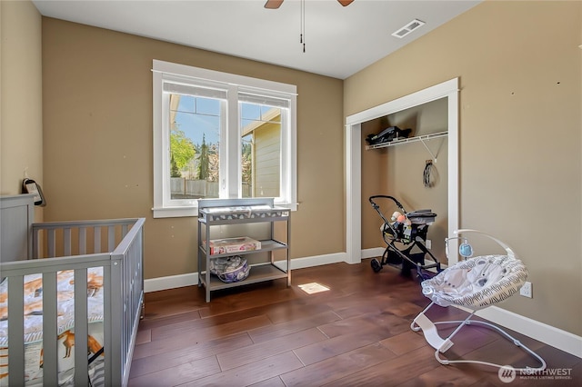 9440 Piperhill Dr SE, Olympia, WA 98513 - bedroom with baseboards, wood finished floors, a closet, and a ceiling fan