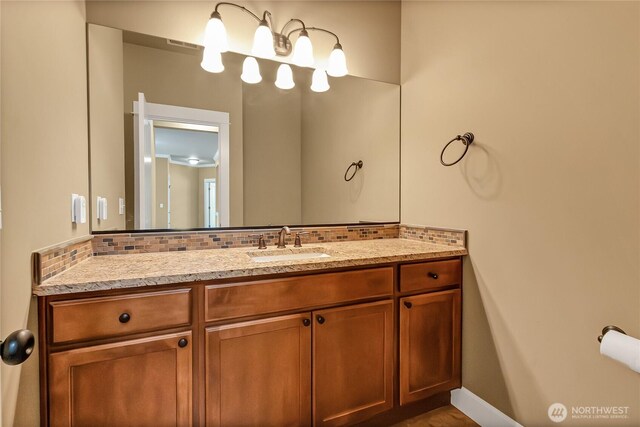 9440 Piperhill Dr SE, Olympia, WA 98513 - bathroom featuring backsplash and vanity