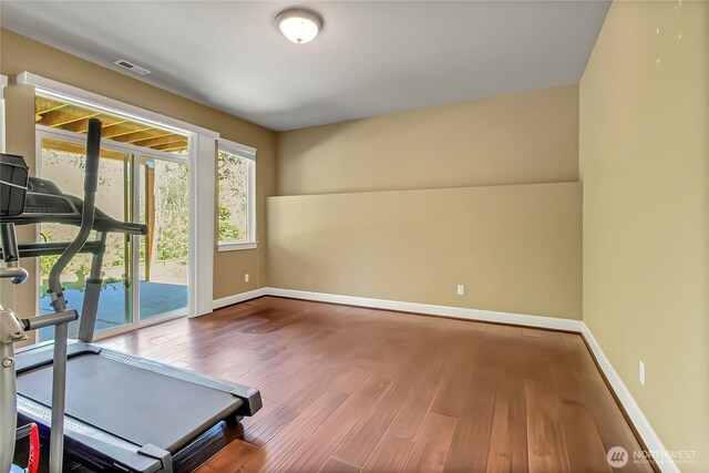 9440 Piperhill Dr SE, Olympia, WA 98513 - exercise area featuring wood finished floors and baseboards
