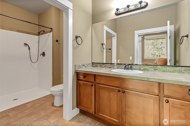 9440 Piperhill Dr SE, Olympia, WA 98513 - bathroom featuring decorative backsplash, toilet, a shower, and vanity