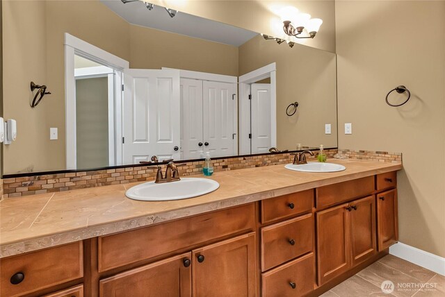 9440 Piperhill Dr SE, Olympia, WA 98513 - bathroom with double vanity, tasteful backsplash, and baseboards