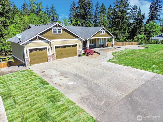 9440 Piperhill Dr SE, Olympia, WA 98513 - craftsman house with a porch, a garage, concrete driveway, and stone siding