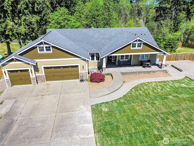 9440 Piperhill Dr SE, Olympia, WA 98513 - craftsman house with an attached garage, stone siding, and driveway