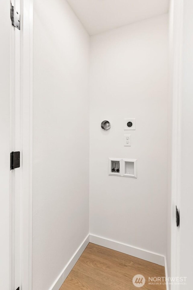 24212 SE 223rd St, Maple Valley, WA 98038 - washroom featuring electric dryer hookup, baseboards, light wood-type flooring, and hookup for a washing machine