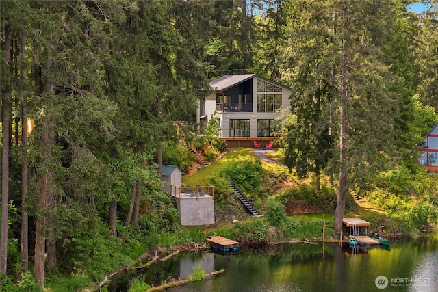 13703 Tastad Rd, Arlington, WA 98223 - view from above of property with a nearby body of water and a heavily wooded area