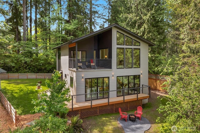 13703 Tastad Rd, Arlington, WA 98223 - rear view of house with a fire pit and a wooden deck