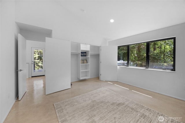 13703 Tastad Rd, Arlington, WA 98223 - unfurnished bedroom with high vaulted ceiling, a closet, baseboards, and recessed lighting