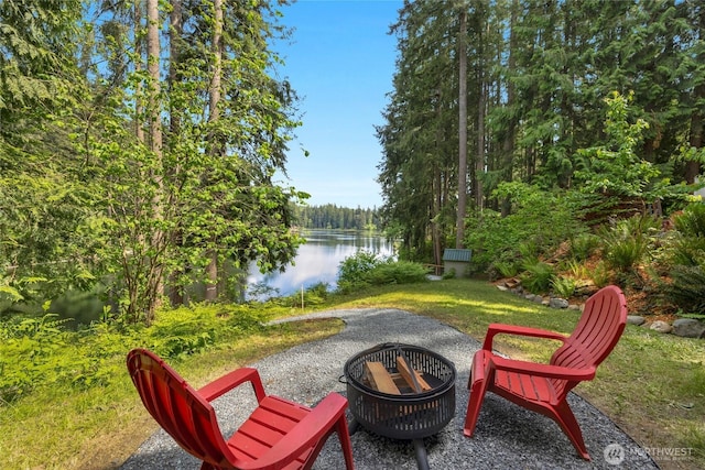 13703 Tastad Rd, Arlington, WA 98223 - view of patio / terrace featuring an outdoor fire pit, a water view, and a forest view