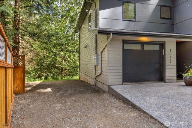 13703 Tastad Rd, Arlington, WA 98223 - view of property exterior featuring a garage