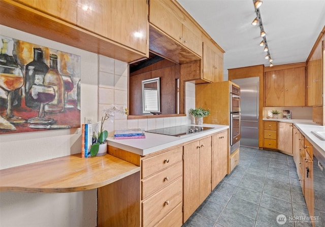 6217 Hillcrest Dr SW, Lakewood, WA 98499 - kitchen featuring black electric stovetop, light countertops, tile patterned floors, and rail lighting