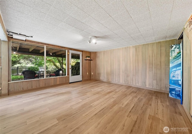 6217 Hillcrest Dr SW, Lakewood, WA 98499 - spare room featuring wood finished floors and wooden walls