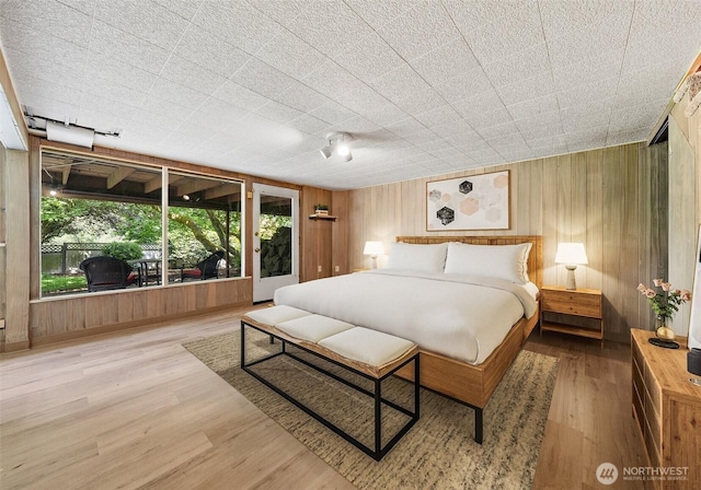 6217 Hillcrest Dr SW, Lakewood, WA 98499 - bedroom featuring wooden walls and wood finished floors