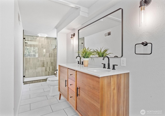 6217 Hillcrest Dr SW, Lakewood, WA 98499 - full bathroom with toilet, tile patterned floors, double vanity, a stall shower, and a textured wall