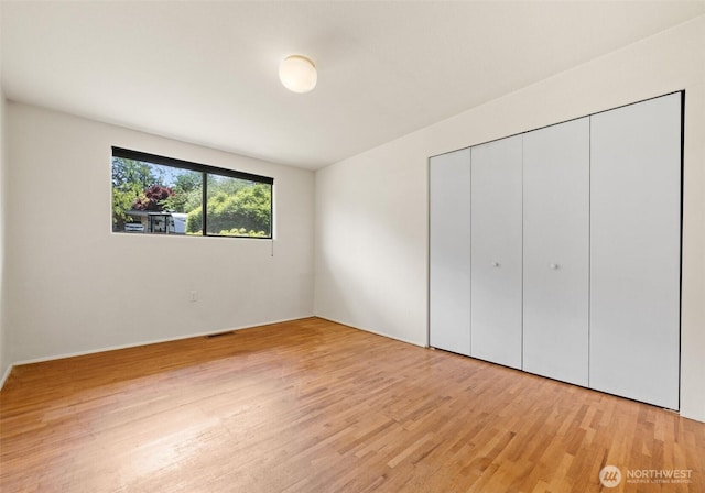 6217 Hillcrest Dr SW, Lakewood, WA 98499 - unfurnished bedroom with light wood finished floors and a closet