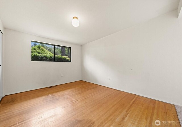 6217 Hillcrest Dr SW, Lakewood, WA 98499 - empty room with wood finished floors and baseboards