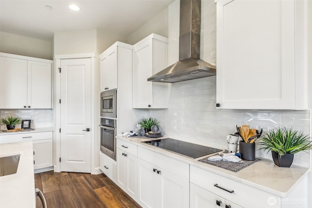 10610 134th Dr NE Unit 111, Lake Stevens, WA 98258 - kitchen with stainless steel appliances, wall chimney range hood, white cabinets, dark wood-type flooring, and recessed lighting