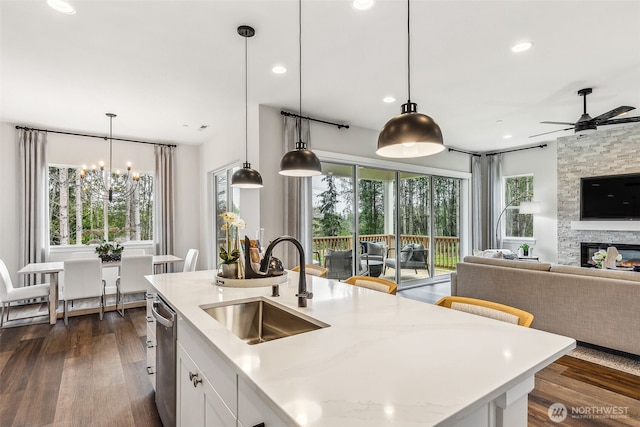 10610 134th Dr NE Unit 111, Lake Stevens, WA 98258 - kitchen with a sink, healthy amount of natural light, a chandelier, white cabinetry, and recessed lighting