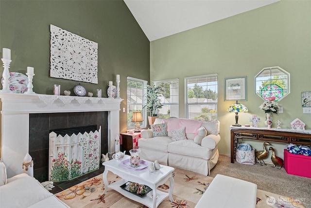 7608 145th Avenue Ct E, Sumner, WA 98390 - carpeted living room featuring high vaulted ceiling and a tile fireplace