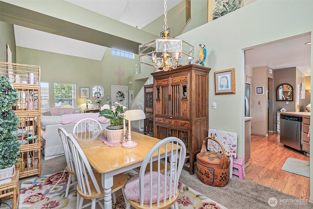 7608 145th Avenue Ct E, Sumner, WA 98390 - dining room with high vaulted ceiling, plenty of natural light, light wood-style flooring, and a chandelier