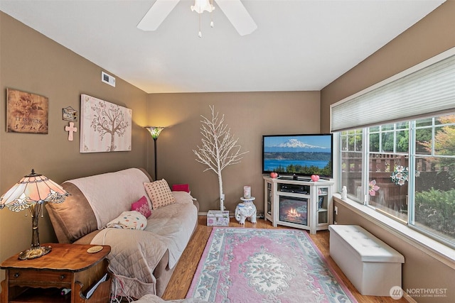 7608 145th Avenue Ct E, Sumner, WA 98390 - living area featuring wood finished floors and ceiling fan
