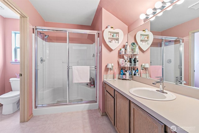 7608 145th Avenue Ct E, Sumner, WA 98390 - full bathroom featuring toilet, a shower stall, vanity, and tile patterned floors