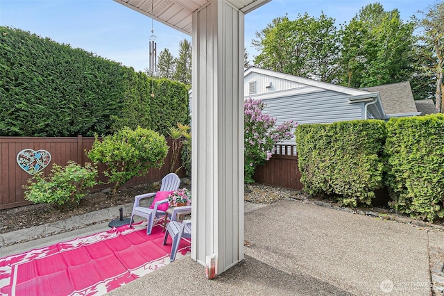 7608 145th Avenue Ct E, Sumner, WA 98390 - fenced backyard featuring a patio