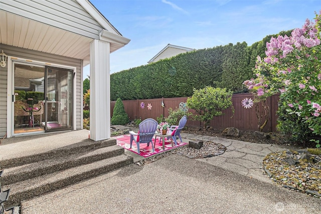 7608 145th Avenue Ct E, Sumner, WA 98390 - fenced backyard featuring a patio area