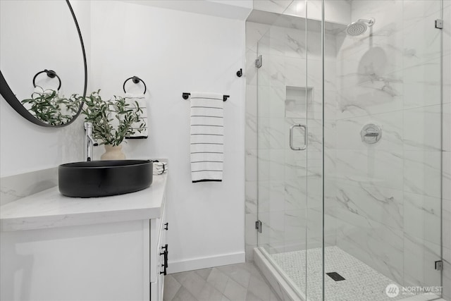 6032 42nd Ave SW Unit C, Seattle, WA 98136 - full bathroom featuring vanity, baseboards, and a marble finish shower