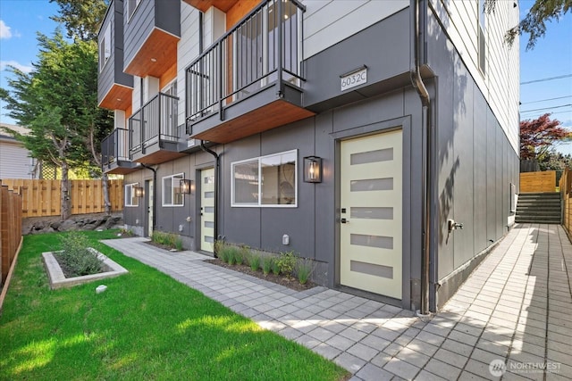 6032 42nd Ave SW Unit C, Seattle, WA 98136 - rear view of property with a balcony