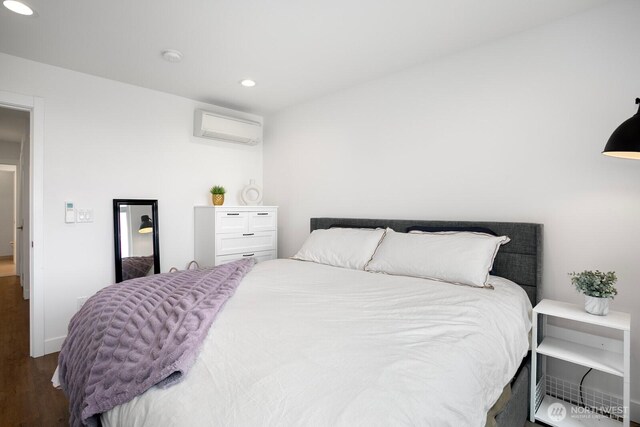 1055 S Cloverdale, Seattle, WA 98108 - bedroom featuring a wall unit AC, wood finished floors, recessed lighting, and baseboards