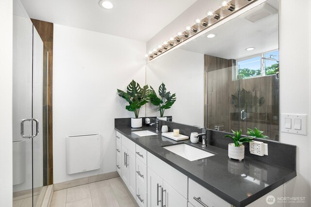 1055 S Cloverdale, Seattle, WA 98108 - full bathroom featuring double vanity, a shower stall, recessed lighting, and tile patterned floors