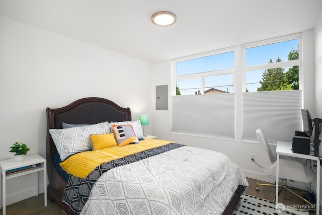 1055 S Cloverdale, Seattle, WA 98108 - bedroom featuring electric panel, wood finished floors, and baseboards