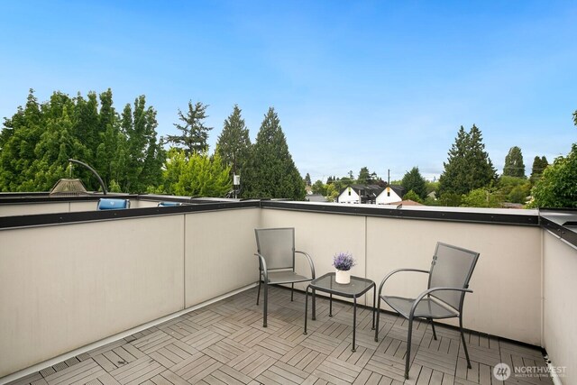 1055 S Cloverdale, Seattle, WA 98108 - balcony with view of scattered trees and a patio