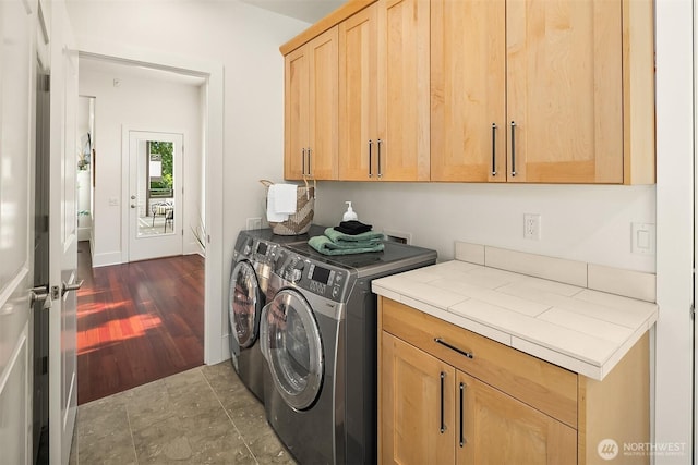 10022 NE 110th St, Kirkland, WA 98033 - laundry room with cabinet space, washer and dryer, and dark wood-style flooring