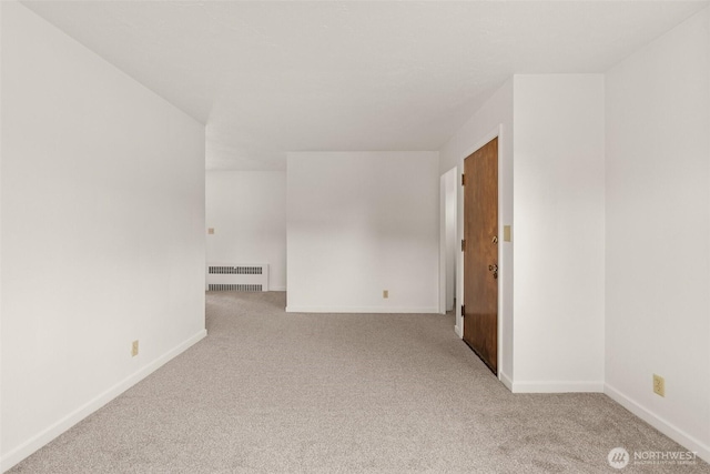 525527 16th Ave SE, Olympia, WA 98501 - spare room featuring radiator, carpet, and baseboards