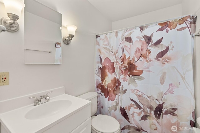 525527 16th Ave SE, Olympia, WA 98501 - bathroom with toilet, vanity, and a shower with shower curtain