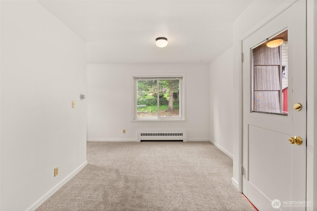 525527 16th Ave SE, Olympia, WA 98501 - empty room featuring baseboards, carpet, and radiator heating unit