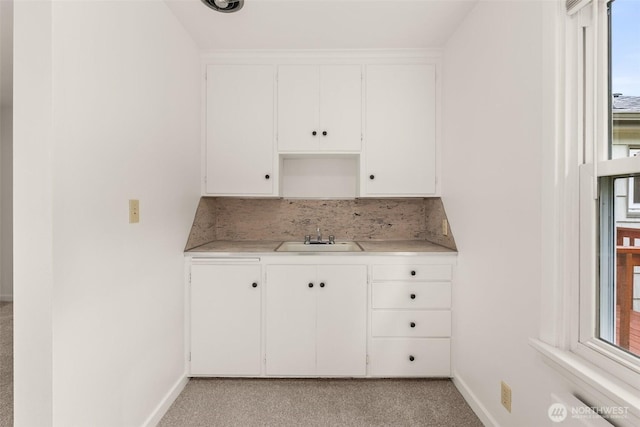 525527 16th Ave SE, Olympia, WA 98501 - kitchen with a sink, baseboards, and healthy amount of natural light