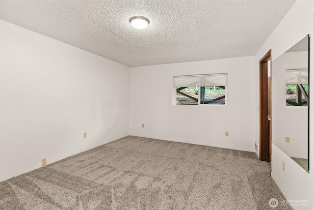 525527 16th Ave SE, Olympia, WA 98501 - unfurnished room featuring carpet and a textured ceiling