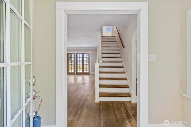 243 N Garden St, Bellingham, WA 98225 - entryway featuring french doors, wood finished floors, stairway, and baseboards