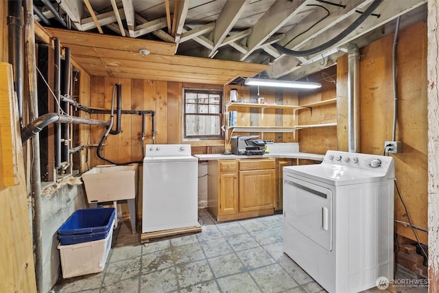 243 N Garden St, Bellingham, WA 98225 - laundry room featuring washer and clothes dryer, cabinet space, and wood walls